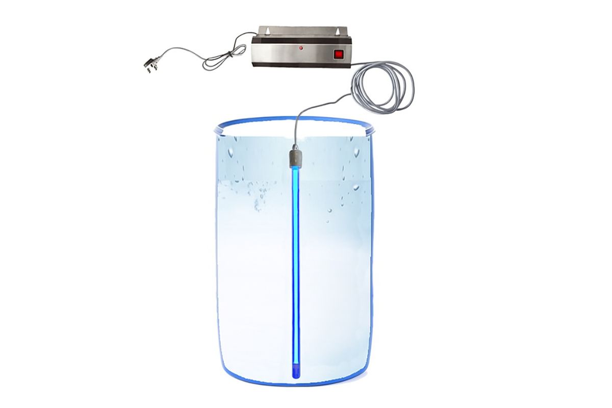 Submersible UV water sterilizer system with blue light bulb submerged in a clear water tank, connected to a power unit.
