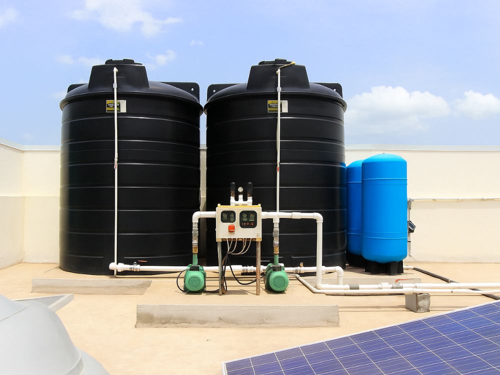 A large, clean commercial water tank on the rooftop of a building in Nairobi, Kenya, signifying the importance of professional cleaning and maintenance for businesses